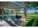 Community BBQ area with shaded seating and grill at 2928 Cape Verde Ln, Las Vegas, NV 89128