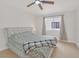 Spacious bedroom with ceiling fan and large window at 2928 Cape Verde Ln, Las Vegas, NV 89128
