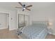 Bright bedroom featuring a queen-size bed and mirrored closet doors at 2928 Cape Verde Ln, Las Vegas, NV 89128