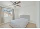 Bedroom with ceiling fan and window with view at 2928 Cape Verde Ln, Las Vegas, NV 89128