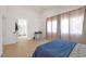 Spacious bedroom with ensuite bathroom access and light wood floors at 2928 Cape Verde Ln, Las Vegas, NV 89128