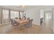 Light and airy dining area with a wood table and gray chairs at 2928 Cape Verde Ln, Las Vegas, NV 89128