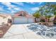 Two-story house with a two-car garage and mature trees at 2928 Cape Verde Ln, Las Vegas, NV 89128