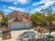 Two-story house with a two-car garage and desert landscaping at 2928 Cape Verde Ln, Las Vegas, NV 89128