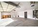 Attached garage with workshop area and storage cabinets at 2928 Cape Verde Ln, Las Vegas, NV 89128