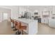 Modern kitchen with white cabinets, stainless steel appliances, and a large island at 2928 Cape Verde Ln, Las Vegas, NV 89128