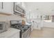 Updated kitchen with stainless steel appliances and quartz countertops at 2928 Cape Verde Ln, Las Vegas, NV 89128