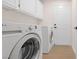 Laundry room with washer, dryer, and cabinets at 2928 Cape Verde Ln, Las Vegas, NV 89128