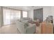 Living room features a fireplace, comfortable sofas, and sliding glass doors at 2928 Cape Verde Ln, Las Vegas, NV 89128