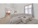 Spacious living room with a large sectional sofa and high ceilings at 2928 Cape Verde Ln, Las Vegas, NV 89128