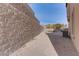 Backyard with retaining walls and AC unit at 37 Carolina Cherry Dr, Las Vegas, NV 89141