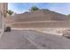 Backyard with retaining walls and AC unit at 37 Carolina Cherry Dr, Las Vegas, NV 89141
