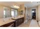 Elegant bathroom with double vanity, soaking tub, and walk-in shower at 37 Carolina Cherry Dr, Las Vegas, NV 89141