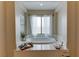 Relaxing bathroom with a large soaking tub and window at 37 Carolina Cherry Dr, Las Vegas, NV 89141