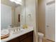 Clean bathroom with single vanity and updated toilet at 37 Carolina Cherry Dr, Las Vegas, NV 89141