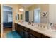Shared bathroom with double vanity and access to bedrooms at 37 Carolina Cherry Dr, Las Vegas, NV 89141