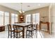 Bright dining room with a wooden table and chairs, and access to backyard at 37 Carolina Cherry Dr, Las Vegas, NV 89141