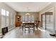 Bright dining room with a wooden table and chairs, and access to backyard at 37 Carolina Cherry Dr, Las Vegas, NV 89141