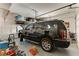 Garage with SUV, storage, and shelving at 37 Carolina Cherry Dr, Las Vegas, NV 89141