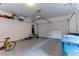 Garage with overhead storage and bicycle at 37 Carolina Cherry Dr, Las Vegas, NV 89141