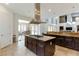 Kitchen island with granite countertop and gas cooktop at 37 Carolina Cherry Dr, Las Vegas, NV 89141