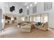 Spacious living room featuring a large sectional sofa and high ceilings at 37 Carolina Cherry Dr, Las Vegas, NV 89141