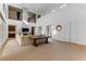 Spacious living room with high ceilings, neutral carpeting and a large sectional sofa at 37 Carolina Cherry Dr, Las Vegas, NV 89141