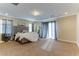 Large main bedroom with plush carpet and access to the outside at 37 Carolina Cherry Dr, Las Vegas, NV 89141