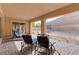 Covered patio with comfortable seating and backyard access at 37 Carolina Cherry Dr, Las Vegas, NV 89141