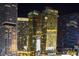 Night view of high-rise buildings featuring modern architecture and vibrant lighting in an urban setting at 3722 Las Vegas Blvd # 305, Las Vegas, NV 89158