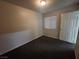 Bedroom with dark carpet and window blinds at 3833 Soda Springs Dr, Las Vegas, NV 89115