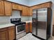 Kitchen with stainless steel appliances and wood cabinets at 3833 Soda Springs Dr, Las Vegas, NV 89115