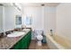 Bathroom with dual sinks, granite countertops, and tile flooring at 4110 Oakhill Ave, Las Vegas, NV 89121