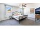 Comfortable bedroom with natural light, soft carpet, ceiling fan and light fixtures at 4110 Oakhill Ave, Las Vegas, NV 89121
