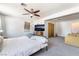 Cozy bedroom with a comfy bed and a mounted TV at 4110 Oakhill Ave, Las Vegas, NV 89121