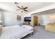 Bedroom with ceiling fan, carpet, and door to adjoining room at 4110 Oakhill Ave, Las Vegas, NV 89121