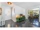 Bright entryway with modern flooring, decorative cabinet, and a view into the dining area at 4110 Oakhill Ave, Las Vegas, NV 89121