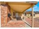 Inviting covered front porch with brick accents and cozy seating at 4110 Oakhill Ave, Las Vegas, NV 89121