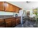 Kitchen featuring stainless steel appliances, granite counters and adjacent dining area at 4110 Oakhill Ave, Las Vegas, NV 89121