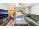 Comfortable living room with a view to the backyard and modern entertainment center at 4110 Oakhill Ave, Las Vegas, NV 89121