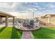 Backyard firepit with chairs, perfect for outdoor gatherings and entertaining guests at 4410 E Boston Ave, Las Vegas, NV 89104