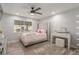 Bright bedroom with a large window, stylish furniture, and soft decor at 4410 E Boston Ave, Las Vegas, NV 89104