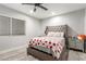 Cozy bedroom with a tufted headboard and side table at 4410 E Boston Ave, Las Vegas, NV 89104