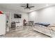 Large bedroom with gray walls, a TV, and a gaming chair setup at 4410 E Boston Ave, Las Vegas, NV 89104