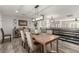 A dining room with an elegant table, seating six, flows into an open floor plan at 4410 E Boston Ave, Las Vegas, NV 89104