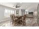 Open-concept dining room features a wooden table, tile floor, and seamless connection to living spaces at 4410 E Boston Ave, Las Vegas, NV 89104
