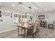 A dining room features a wooden table, modern lighting, and stylish decor at 4410 E Boston Ave, Las Vegas, NV 89104