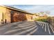 Spacious driveway leading to a two-car garage, with a manicured lawn and modern gate at 4410 E Boston Ave, Las Vegas, NV 89104