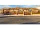 Charming brick home featuring solar panels, a secure gate, and well-maintained landscaping at 4410 E Boston Ave, Las Vegas, NV 89104
