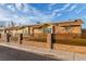 Lovely home featuring an updated fence, fresh green lawn, and a welcoming facade at 4410 E Boston Ave, Las Vegas, NV 89104